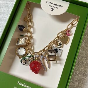 Kate Spade Gold Charm Necklace with Red and Black Accents
